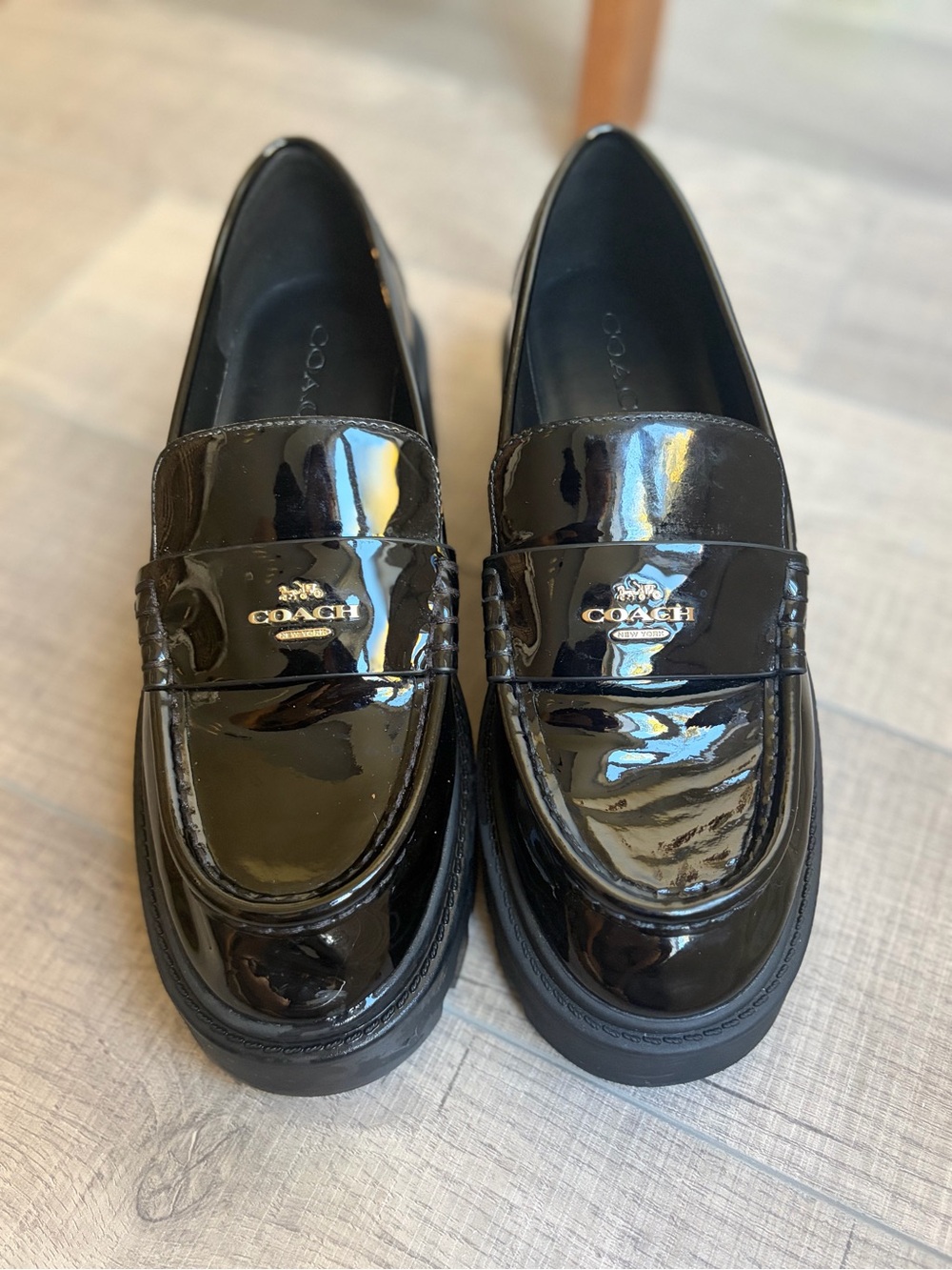 Coach Black Patent Leather Penny Loafers with Gold Emblem